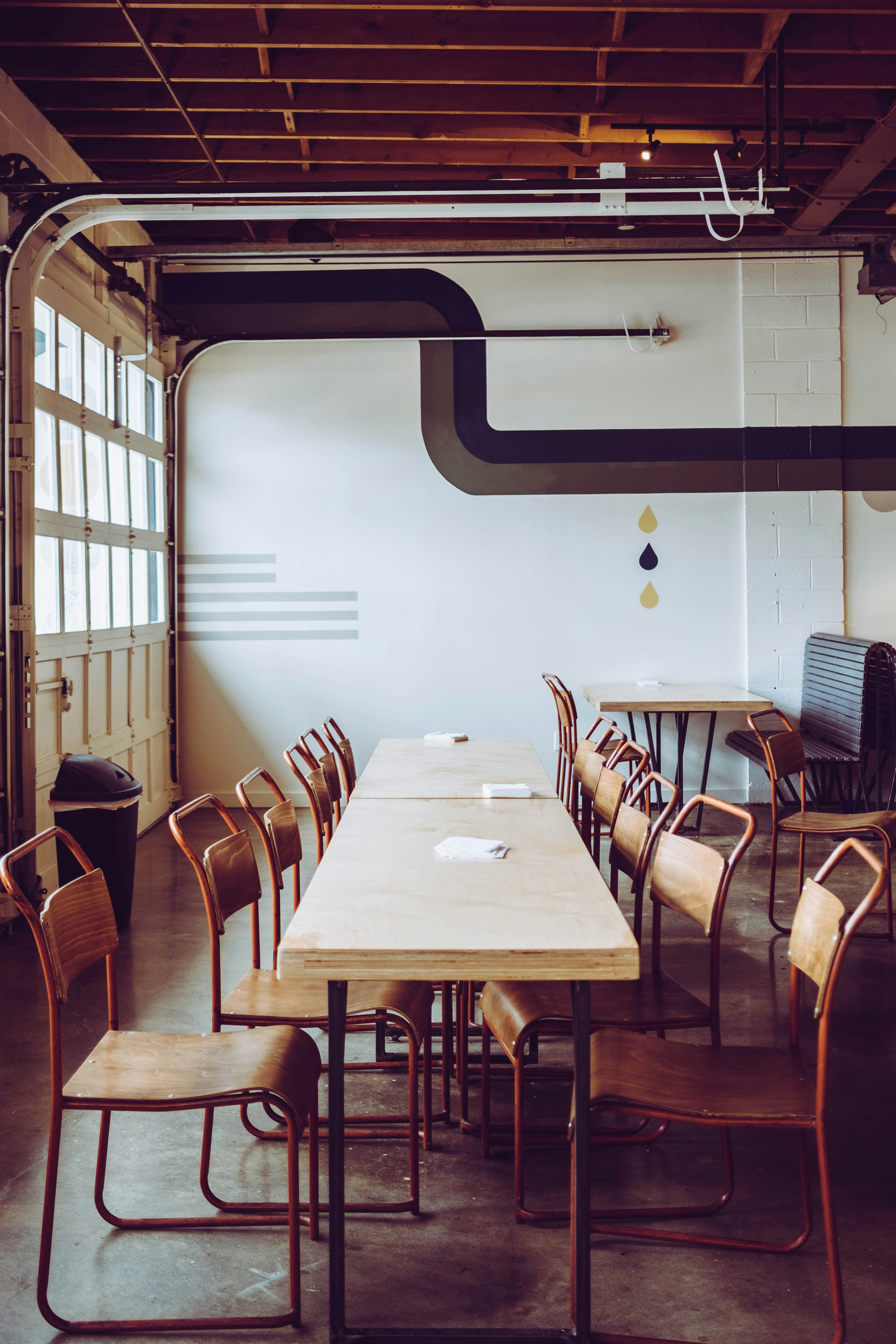 brown chairs arranged in front of brown table